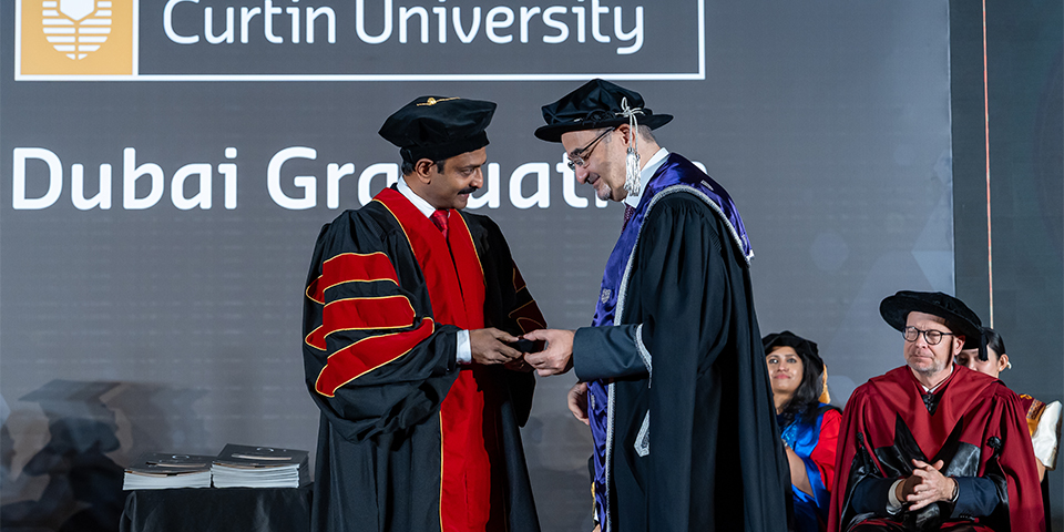 Curtin Dubai academic recognised as John Curtin Distinguished Professor; University awards PhD for significant research contribution 